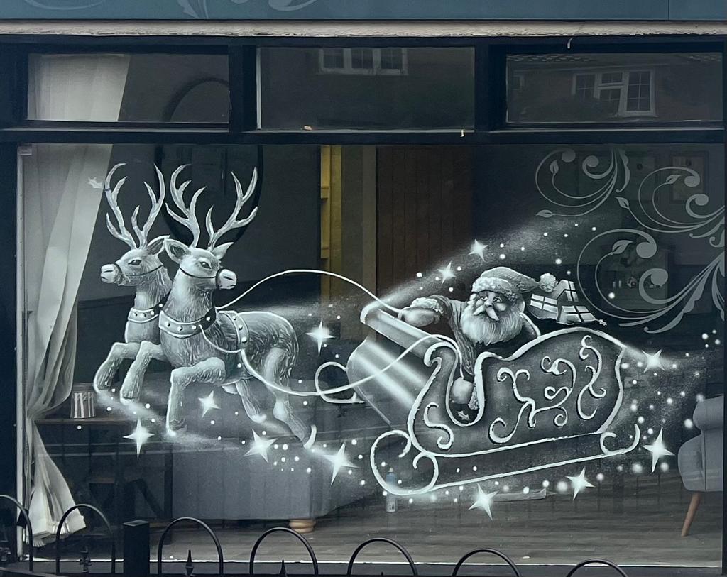 Snow window art, bespoke snow spray installations, snow spray stencils, Christmas window art, Christmas window decoration with snow spray, snow spray art number 1 snow spray artist number 1 window art easy to remove snow spray art sustainable window stencils reusable window stencils