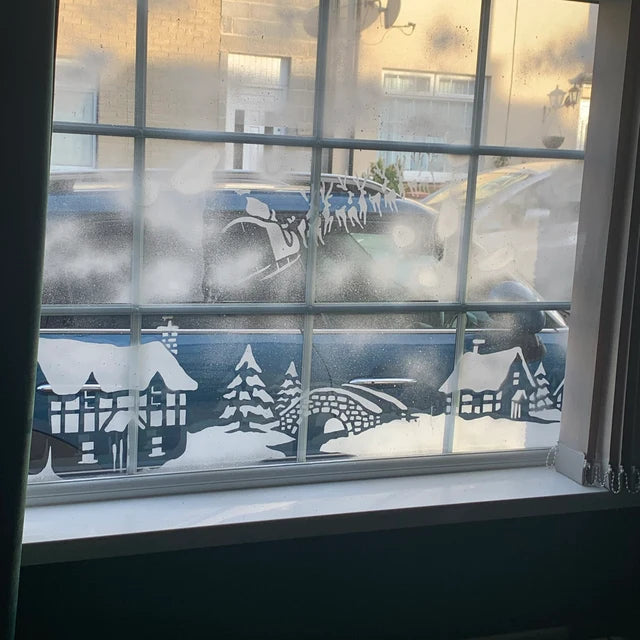 Snow window art, bespoke snow spray installations, snow spray stencils, Christmas window art, Christmas window decoration with snow spray, snow spray art number 1 snow spray artist number 1 window art easy to remove snow spray art sustainable window stencils reusable window stencils