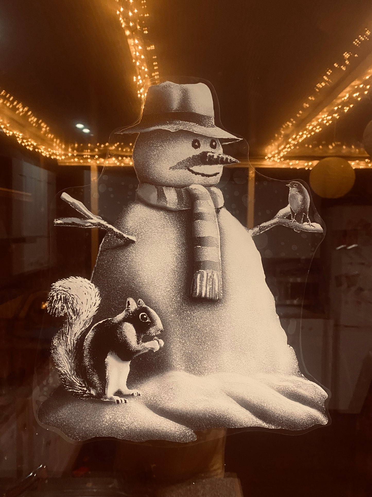 Snow window art, bespoke snow spray installations, snow spray stencils, Christmas window art, Christmas window decoration with snow spray, snow spray art number 1 snow spray artist number 1 window art easy to remove snow spray art sustainable window stencils reusable window stencils snow window