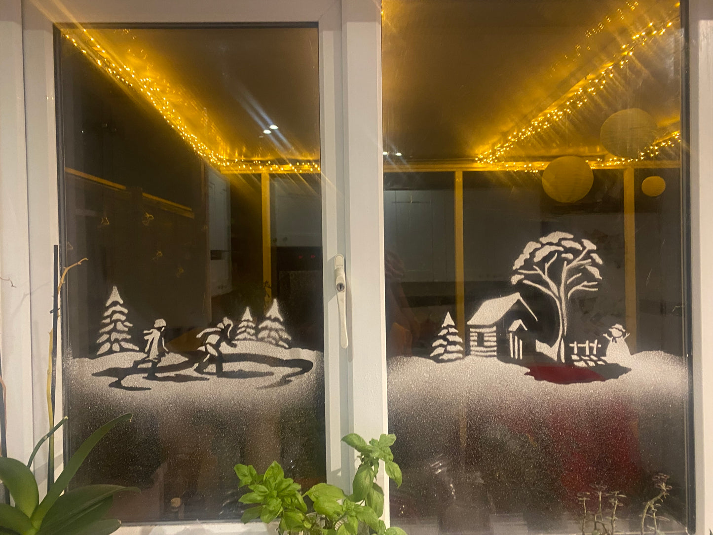 Snow window art, bespoke snow spray installations, snow spray stencils, Christmas window art, Christmas window decoration with snow spray, snow spray art number 1 snow spray artist number 1 window art easy to remove snow spray art sustainable window stencils reusable window stencils snow window 